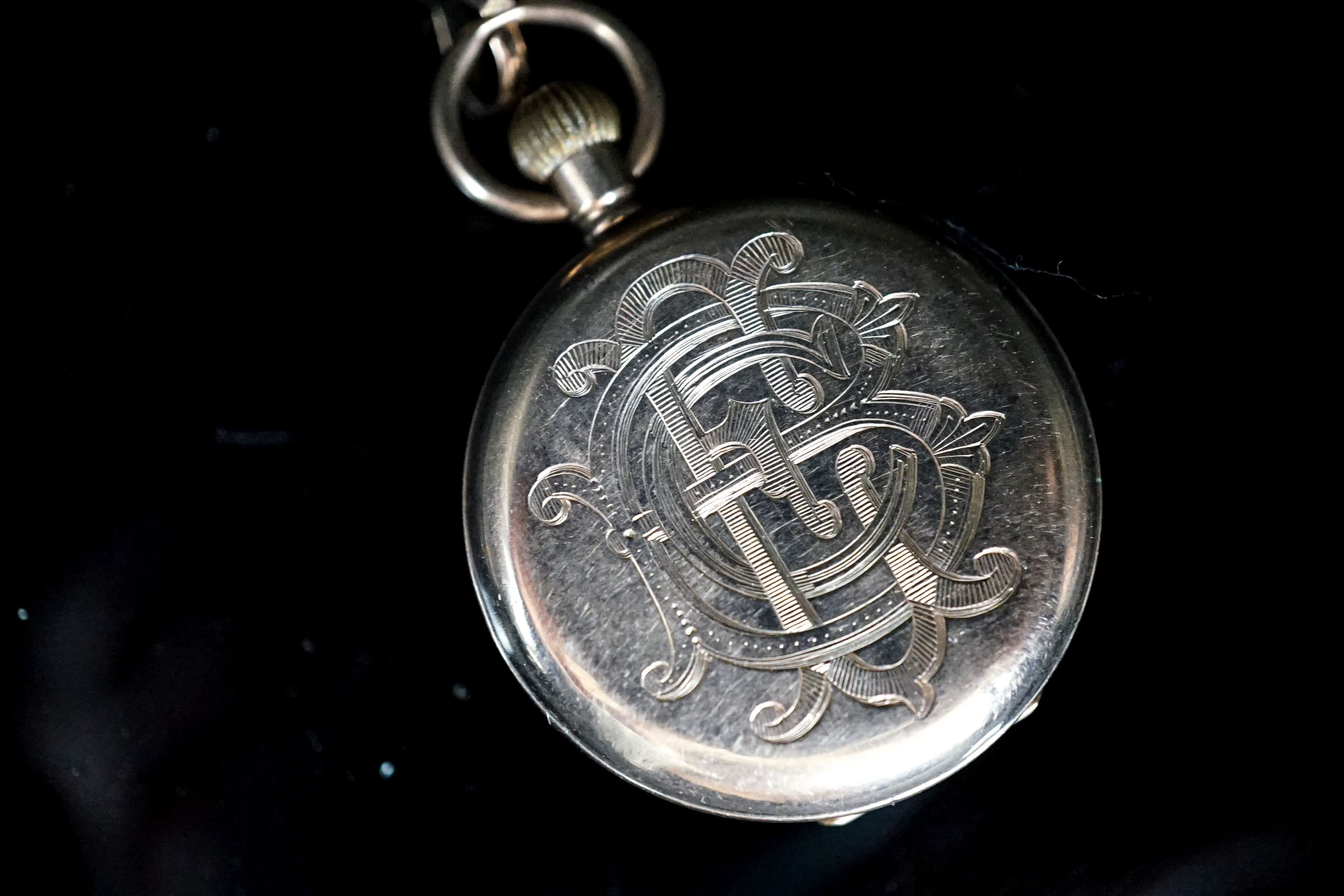 An early 20th century 9ct gold open faced fob watch, case diameter 30mm, on a 9ct suspension brooch, gross weight 26.4 grams.